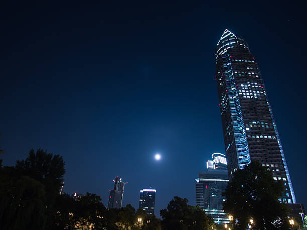Trade Fair Tower, Messeturm, in the exhibition site and full moon in Frankfurt, Germany