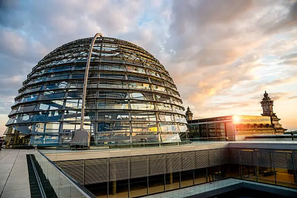 Berlin Reichstag Dome at Sunset. Modern monument with spiral walkways to the top of the Reichstag, Germany's parliament building in the heart of Berlin, Central Berlin, Germany.