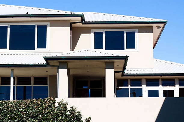 istock Modren white house in sunlight against blue sky 471438159