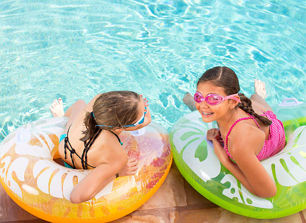 istock Girls in Swimming pool 471438503