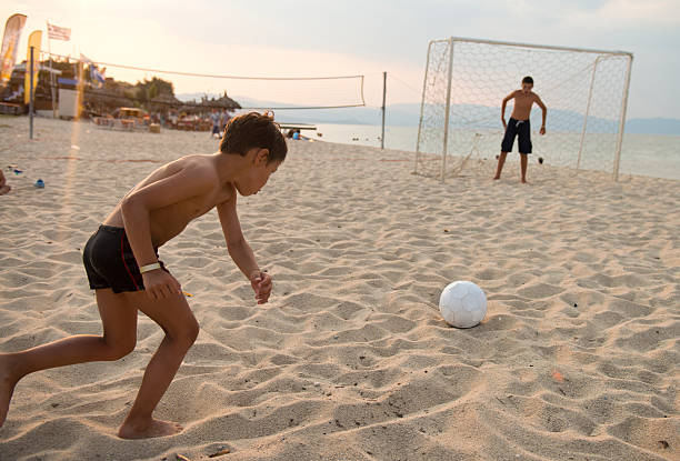 istock Soccer at the beach 471438611