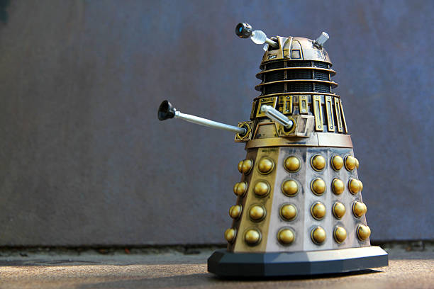 Dalek Invasion Vancouver, Canada - April 20, 2015: A toy Dalek from Dr. Who. the Daleks are a race of malevolent  aliens from the Doctor Who TV series. They are the Doctor's primary recurring foe. Doctor Who is created by the BBC. bbc photos stock pictures, royalty-free photos & images