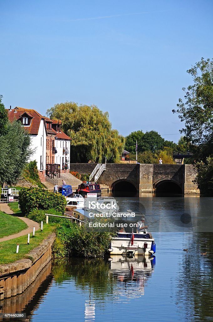 Boats on River Avon, Tewkesbury. Tewkesbury, United Kingdom - September 8, 2014: Boats moored along the River Avon with tourists enjoying the Summer sunshine, Tewkesbury, Gloucestershire, England, UK, Western Europe. 2015 Stock Photo