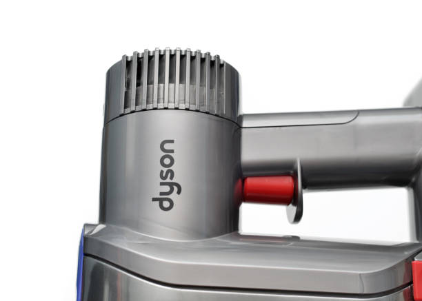 Dyson Vancouver, B.C., Canada -- April 25, 2015:Close up of a Dyson vacuum cleaner against a white background. Dyson is a British company known for it's vacuum cleaners and hand dryers. dyson brand name photos stock pictures, royalty-free photos & images