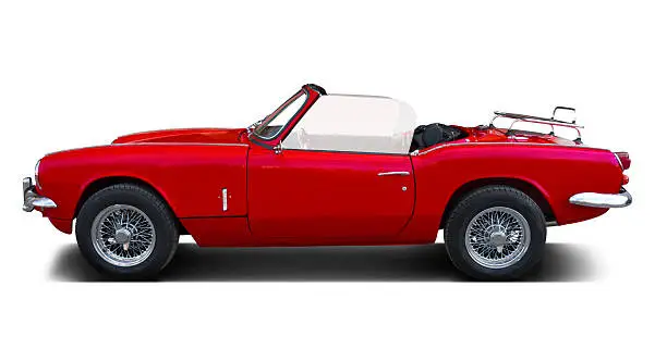 1967 Triumph Spitfire mk3 red isolated on white. Lateral view.