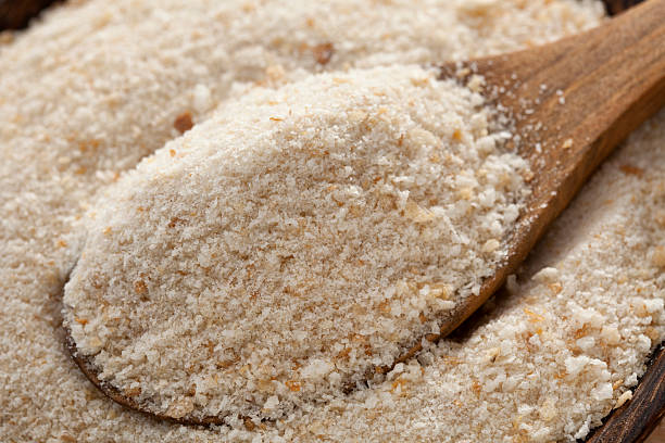 Bread Crumbs Bread crumbs in wooden spoon breaded photos stock pictures, royalty-free photos & images