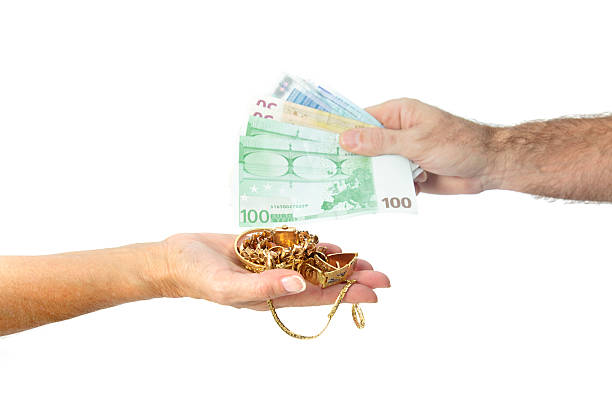 Sellin gold for money stock photo
