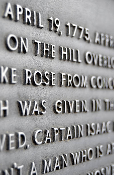 Plaque at Minute Man National Park A plaque tells the story of the "shot heard 'round the world" that began The Revolutionary War in 1775 at Concord, MA. concord massachusetts stock pictures, royalty-free photos & images