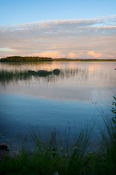 View of a lakeshore in Finland at sunset.