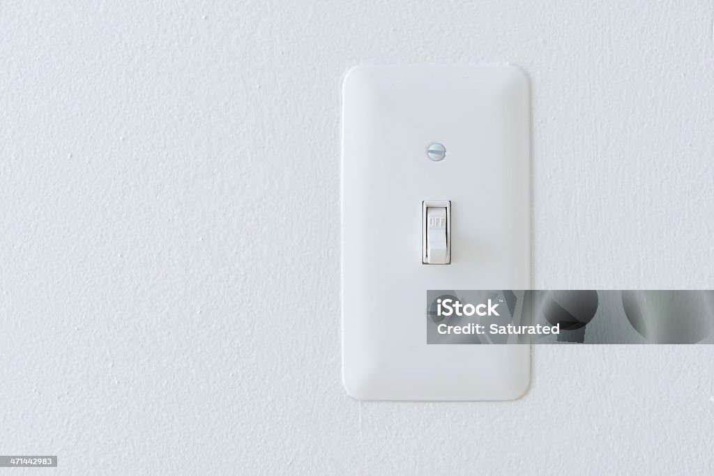 Power Switch On White Wall: "Off" Position A brand new power switch against a freshly painted white wall, with the switch in the "OFF" position. Built Structure Stock Photo