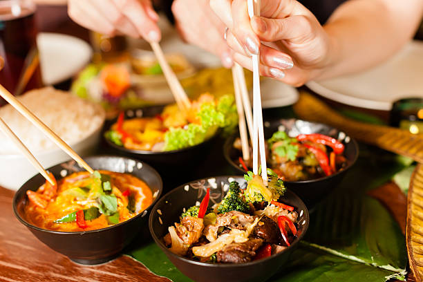 istock People eating Thai food with chopsticks 471444143