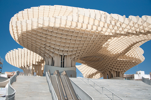 Seville, Spain - June 13, 2012: The structure of the Espace Metropol Parasol by architect Jurgen Mayerin Plaza de la Encarnacion, Sevilla. This  structure was inaugurated in 2011, and it is made from bonded timber with a polyurethane coating. The futuristic structure was designed by J. Mayer H. architects.