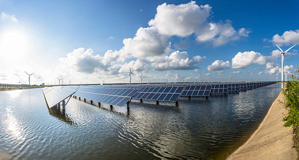 istock solar energy panels and wind turbines 471445592
