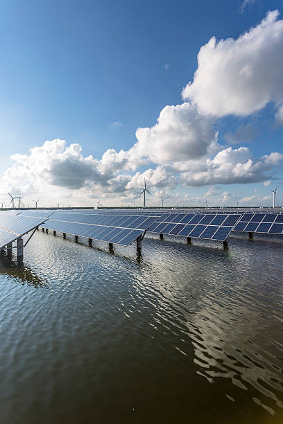 istock solar energy panels and wind turbines 471445600