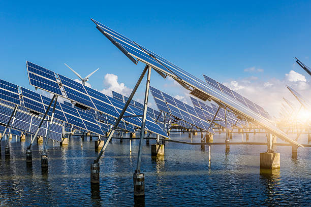 istock solar energy panels and wind turbines 471445624