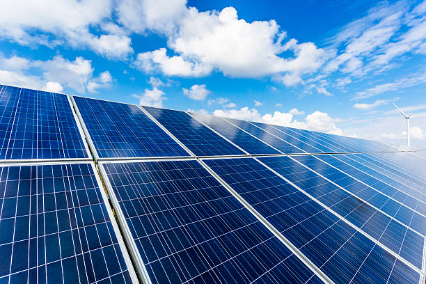 istock solar energy panels and wind turbines 471445642