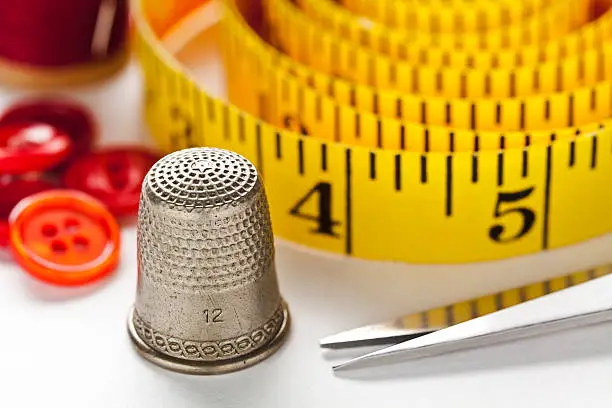 Close up of Thimble, Needle & Thread - great image for Sewing, Crafts and Hand made.