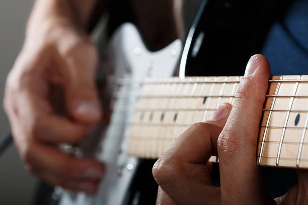 istock Hands of man playing electric guitar 471445876