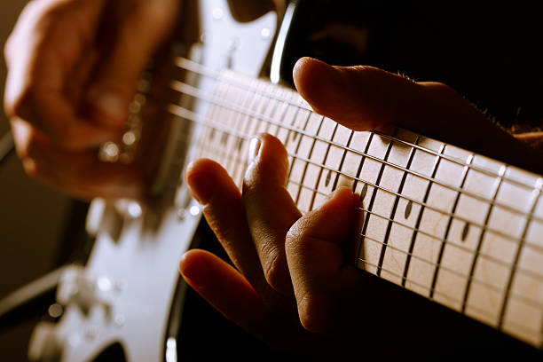 istock Hands of man playing electric guitar 471445892