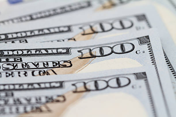 istock Closeup on corners of 100 dollar bills with selective focus 471445908