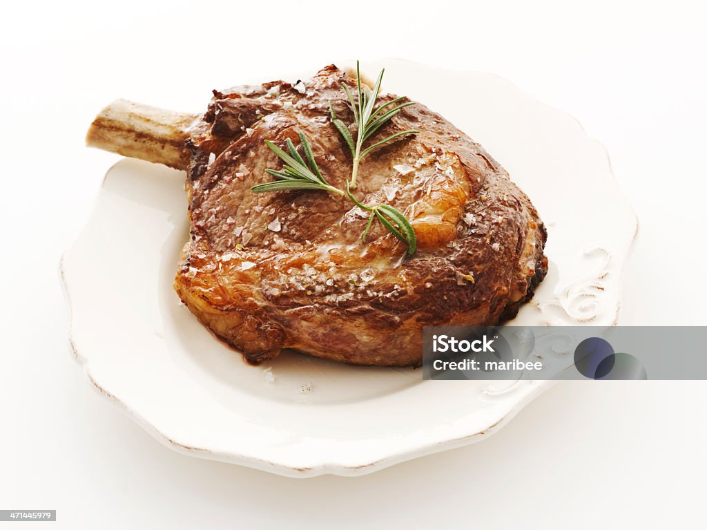 "frenched" ribeye steak prime ribeye steak, frenched and grilled to perfection. finished with sea salt and rosemary. Beef Stock Photo