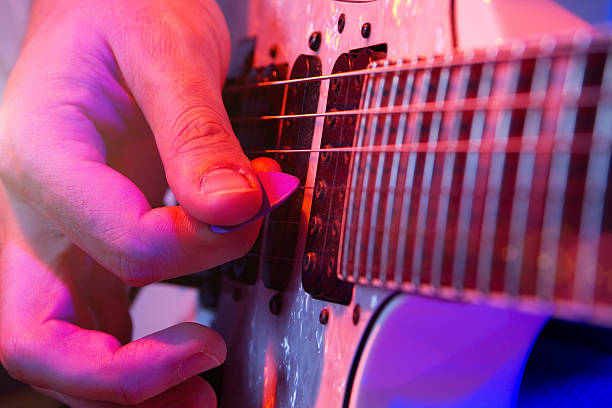 istock young male musician with a white guitar 471446032