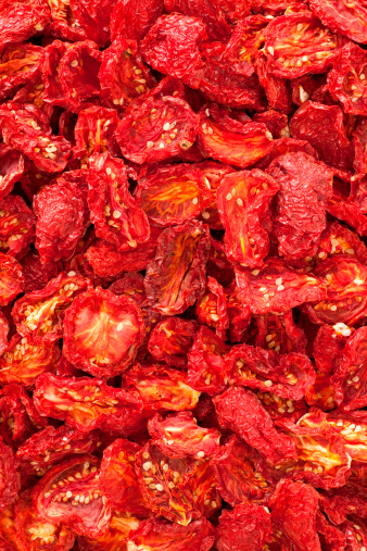 Top view of lots of dried tomatoes