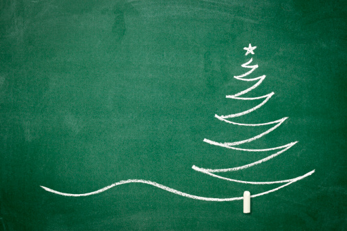 Christmas tree drawn with chalk on the blackboard