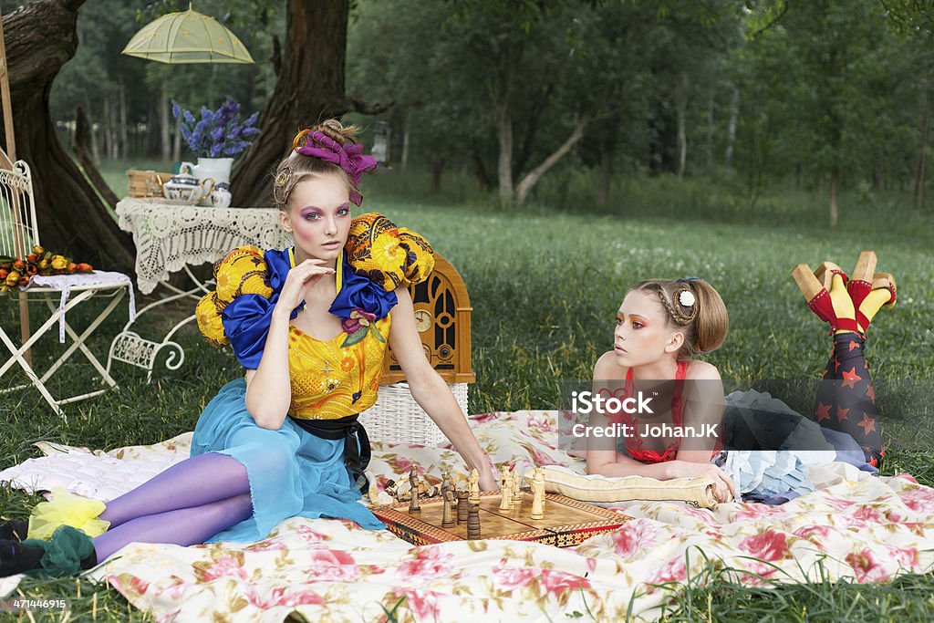 Two beautiful ladies Portrait of two young women sitting in a park. outdoors Adult Stock Photo