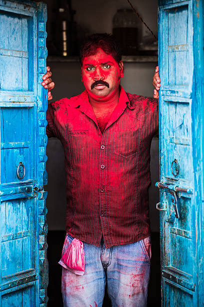 istock Man covered in red powder 471448418