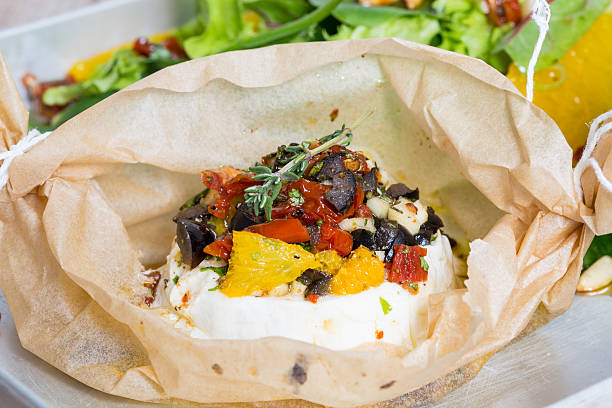 istock Baked goat cheese Mediterranean in parchment paper 471448904