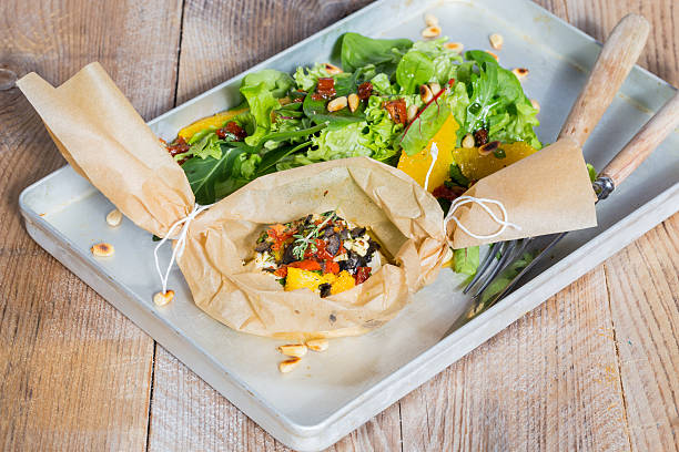 istock Baked goat cheese Mediterranean in parchment paper 471448916
