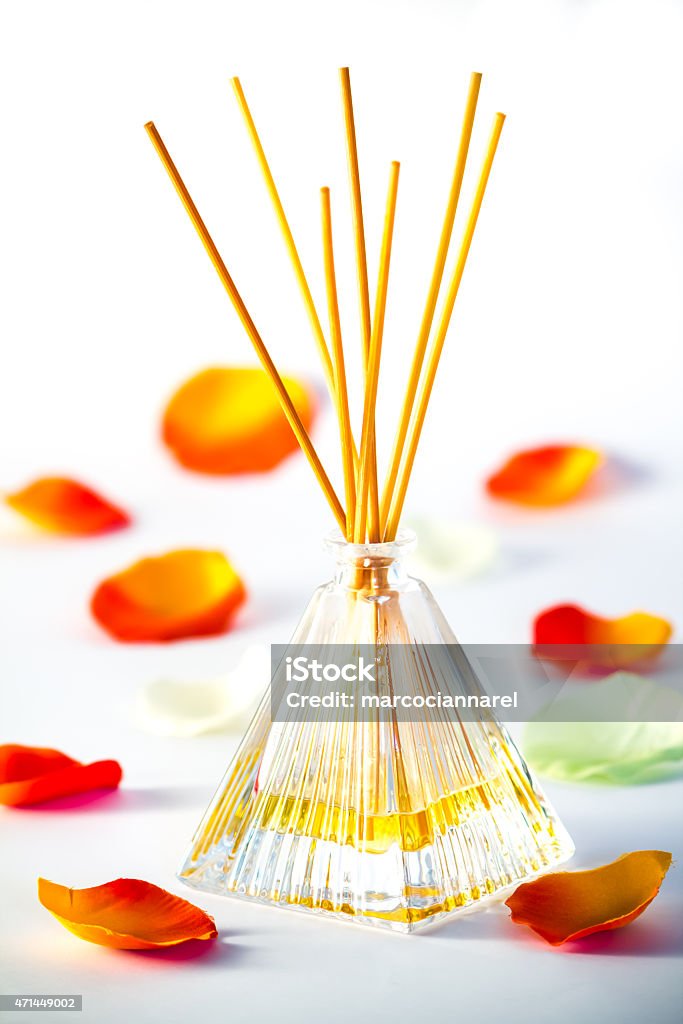 aroma diffuse scented diffuser on white background with petals 2015 Stock Photo