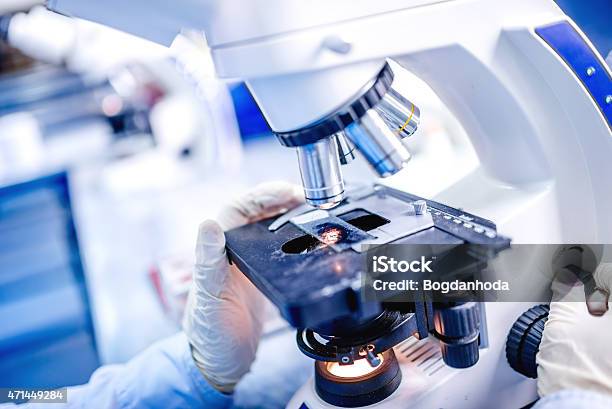 Medical Laboratory Scientist Hands Using Microscope For Chemistry Samples Stock Photo - Download Image Now
