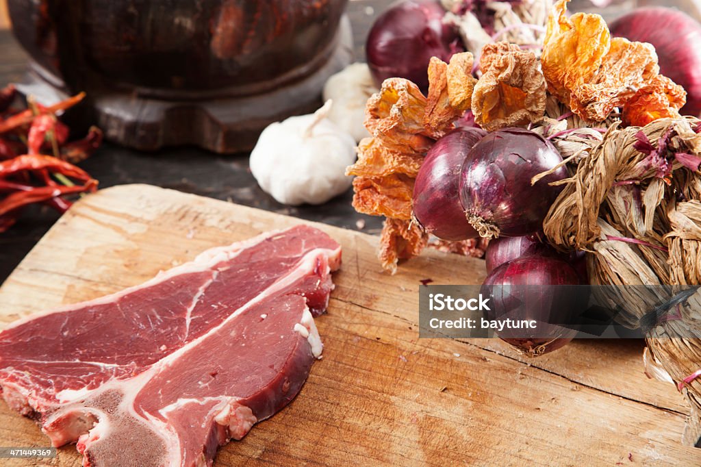 Raw fillet steak Raw fillet steak with onion and garlic in the ottoman kitchen Aging Process Stock Photo