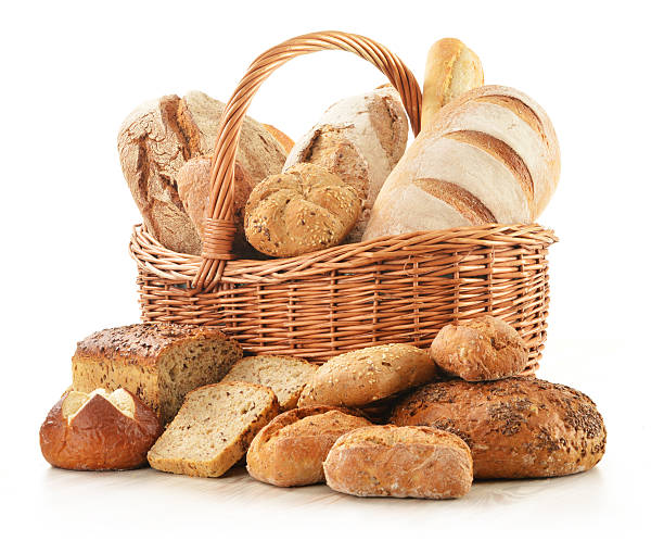 istock Bread and rolls in wicker basket isolated on white 471450177
