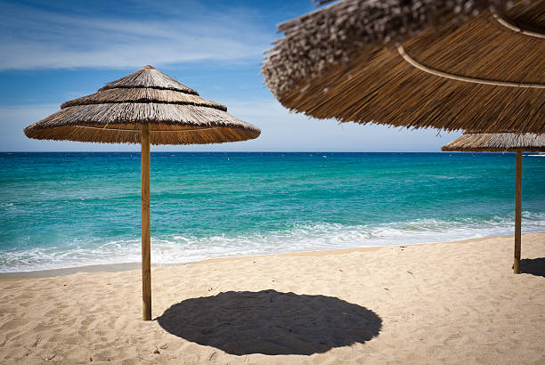 istock Parasol Umbrellas At The Seashore 471450351
