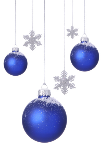 New 2012 blue Christmas ornaments with snow and silver glitter snowflakes hanging on a white background.