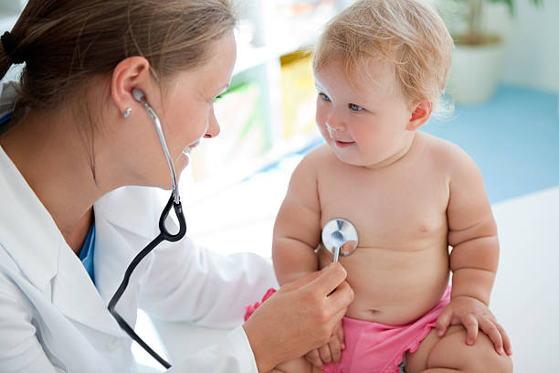 istock Cute baby at doctor's office. 471451405