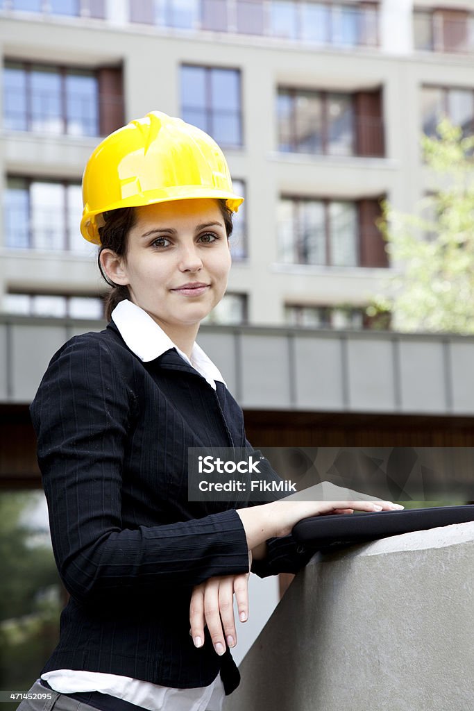 Female construction engineer Female construction engineer in yellow helmet Adult Stock Photo