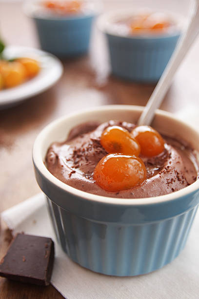 istock Chocolate mousse with kumquat in syrup dessert 471452133