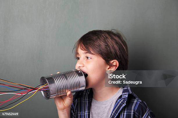 Boy Talking Into Tin Can With Colored Wires Stock Photo - Download Image Now - Boys, Chalkboard - Visual Aid, Child