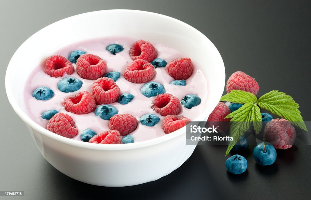 Raspberry, blueberry and yogurt dessert Raspberry, blueberry and yogurt dessert on dark background Berry Fruit Stock Photo