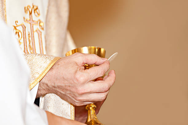 istock Communion and clergyman 471452981
