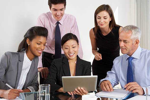 istock Group Of Business People Having Meeting Around Tablet Computer A 471452989