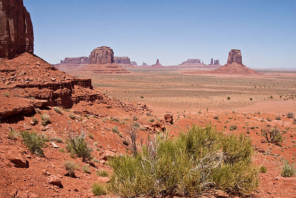 Monument Valley from North Window Overlook The American Southwest has some amazing landscapes, especially the colorful rock formations. The background of blue sky adds color, depth and contrast to the scene. This view of rock formations is in Monument Valley Tribal Park in Arizona, USA. kayenta photos stock pictures, royalty-free photos & images