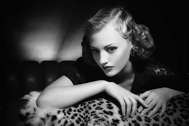 Film Noir style. Female portrait Emulation of vintage style photography.Grain added for more film effect. film noir style photos stock pictures, royalty-free photos & images