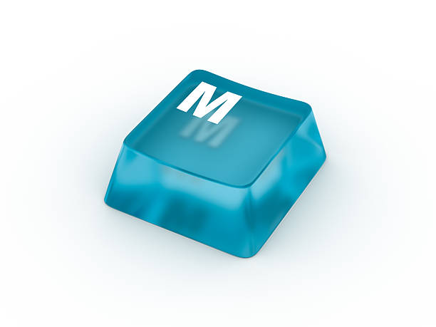Letter M on transparent keyboard button stock photo