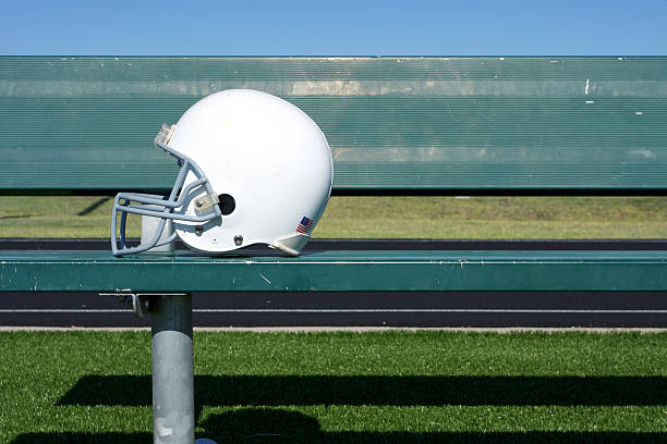 American Football Helmet on the Bench stock photo