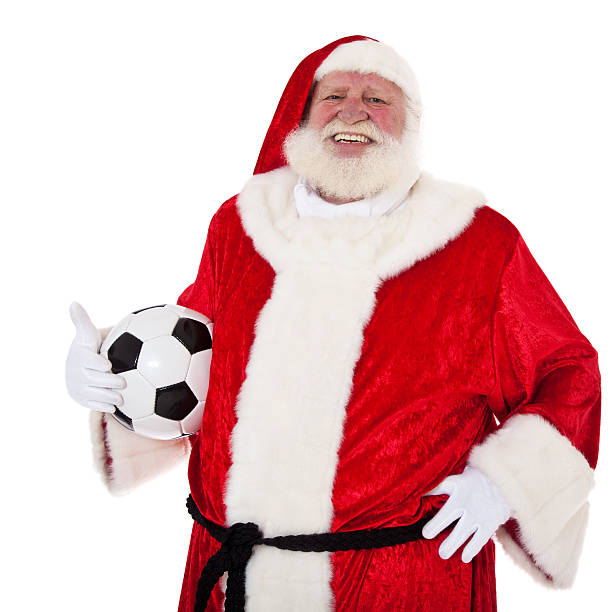 istock Santa Claus holding soccer ball 471456739